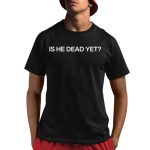 Joan Baez Wearing Is He Dead Yet Shirt