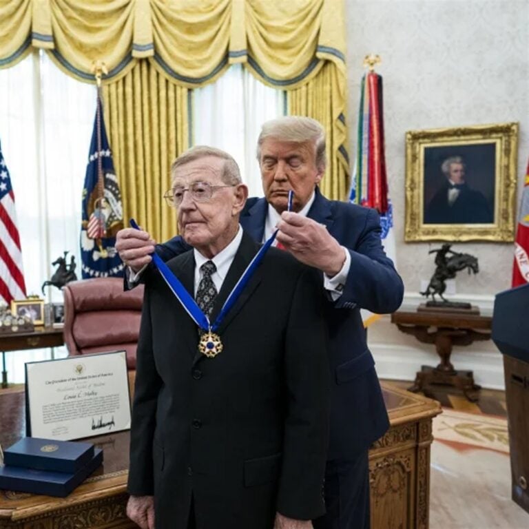 President Donald Trump presents the Medal of Freedom to former college football coach Lou Holtz